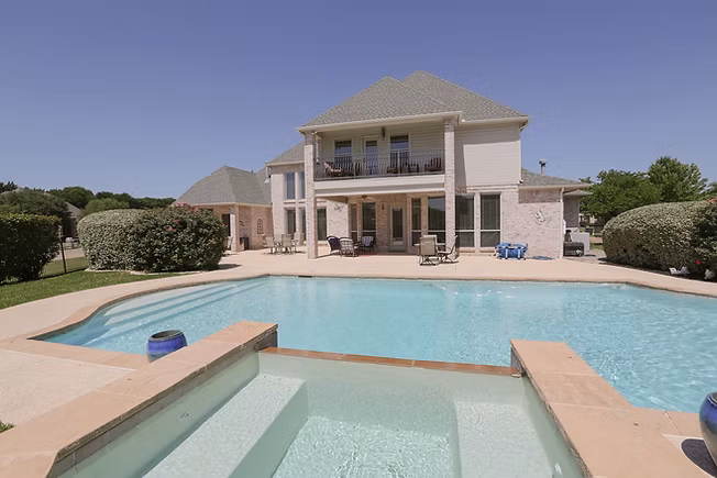 Beautiful residential pool with landscaping